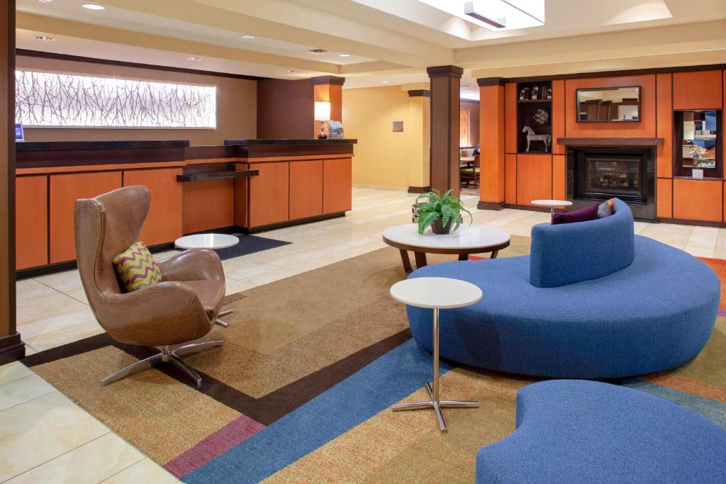 a lobby with two chairs and a couch and a table at Fairfield Inn and Suites by Marriott Seymour in Seymour