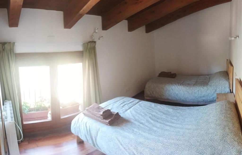 Postel nebo postele na pokoji v ubytování Apartamentos Rurales Rad Icarium