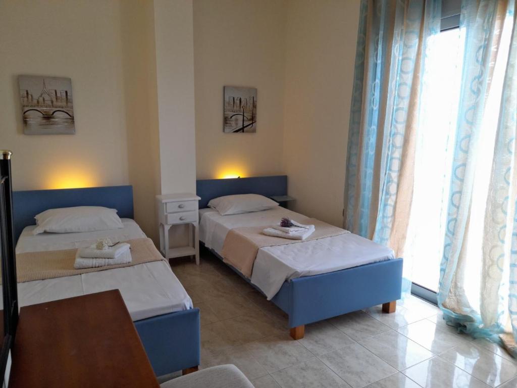 Postel nebo postele na pokoji v ubytování Pearl Villas Apolakkia - Beach Front Villas with Private Pool