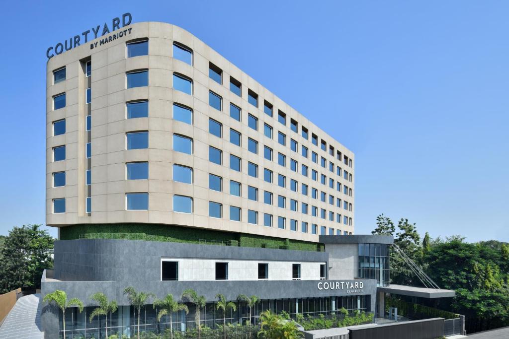 a rendering of the front of a hotel at Courtyard by Marriott Nashik in Nashik