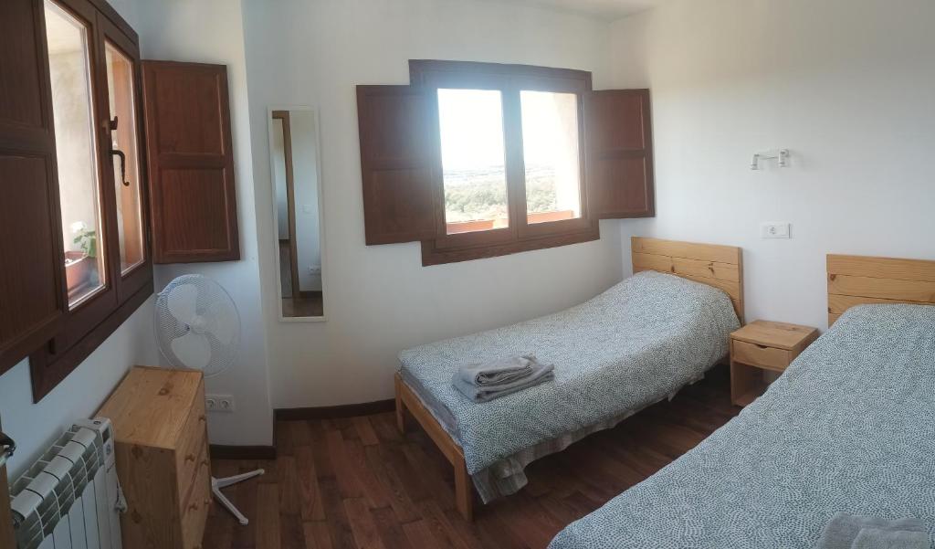 Postel nebo postele na pokoji v ubytování Apartamentos Rurales Rad Icarium