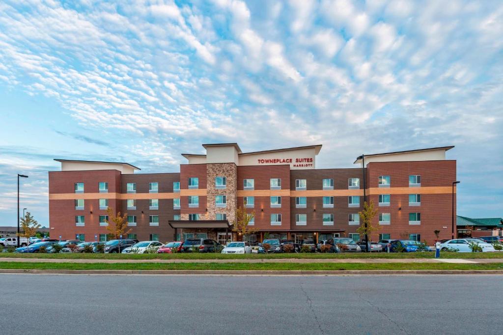 a large building with cars parked in a parking lot at TownePlace Suites by Marriott Lexington Keeneland/Airport in Lexington