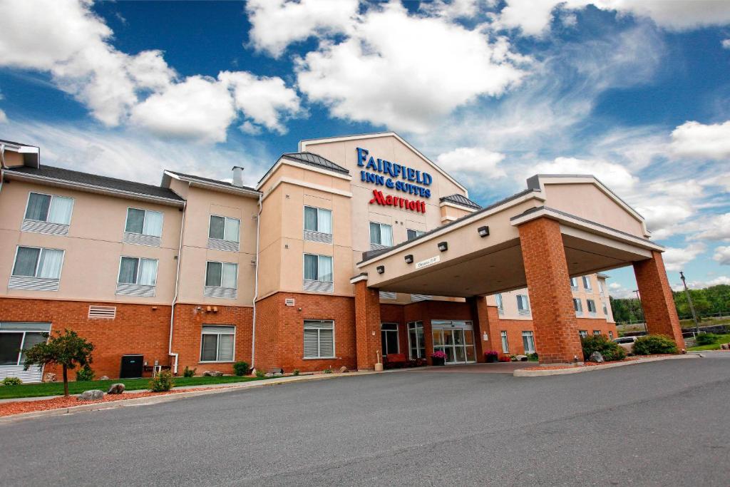 a hotel building with a sign on the front of it at Marriott Fairfield Sudbury in Sudbury