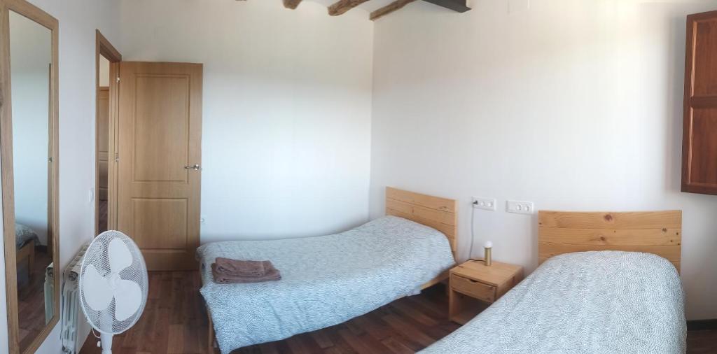 Postel nebo postele na pokoji v ubytování Apartamentos Rurales Rad Icarium