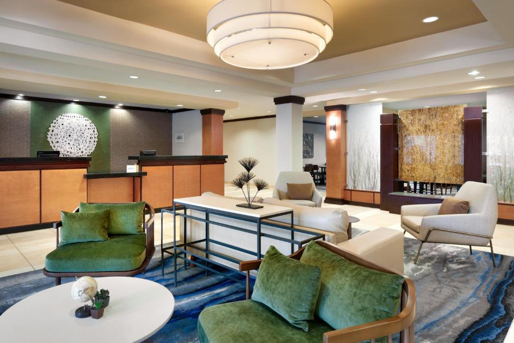 a lobby with couches and chairs and a table at Fairfield Inn & Suites by Marriott Tallahassee Central in Tallahassee