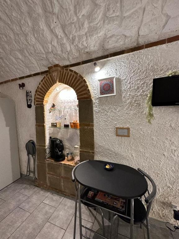 Televízia a/alebo spoločenská miestnosť v ubytovaní La Grotta