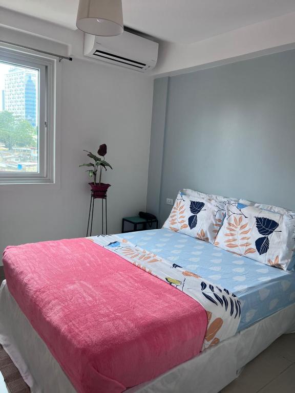 Postel nebo postele na pokoji v ubytování Cebu Mini Hotel