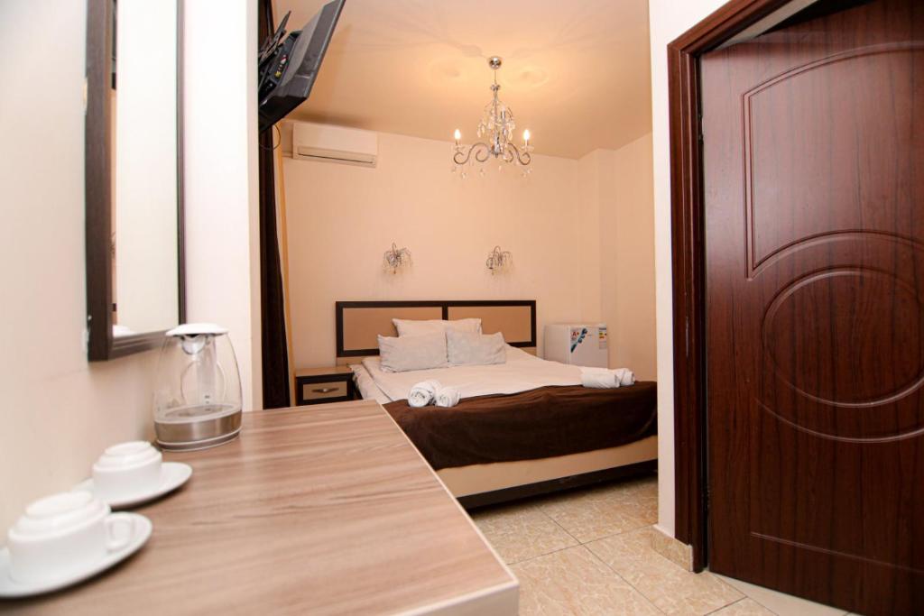 Postel nebo postele na pokoji v ubytování Comfort House Hotel