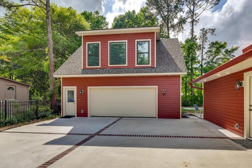 a red house with a garage at Bluffton Vacation Rental - 4 Mi to Tanger Outlets! in Bluffton