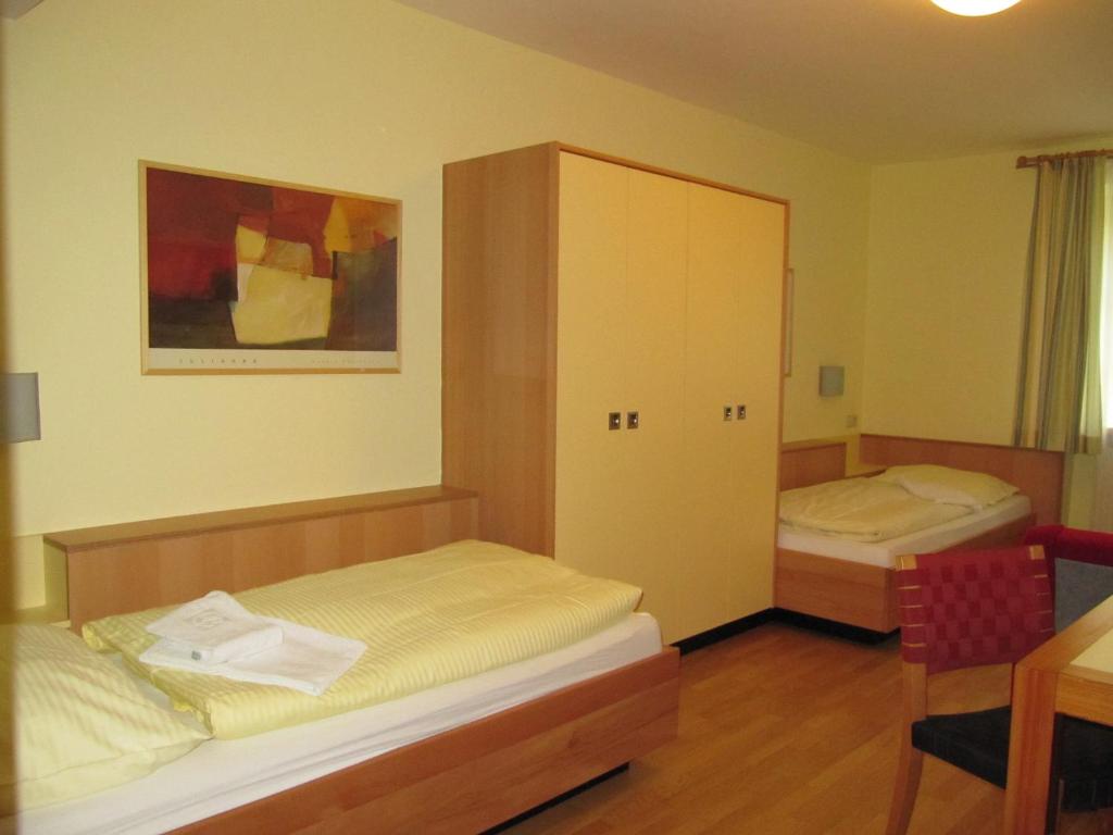 Postel nebo postele na pokoji v ubytování Austrian Sports Resort, BSFZ Obertraun
