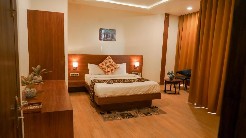 Postel nebo postele na pokoji v ubytování Hotel Chulhewala