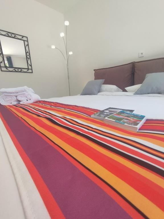 Postel nebo postele na pokoji v ubytování Hôtel Padolo