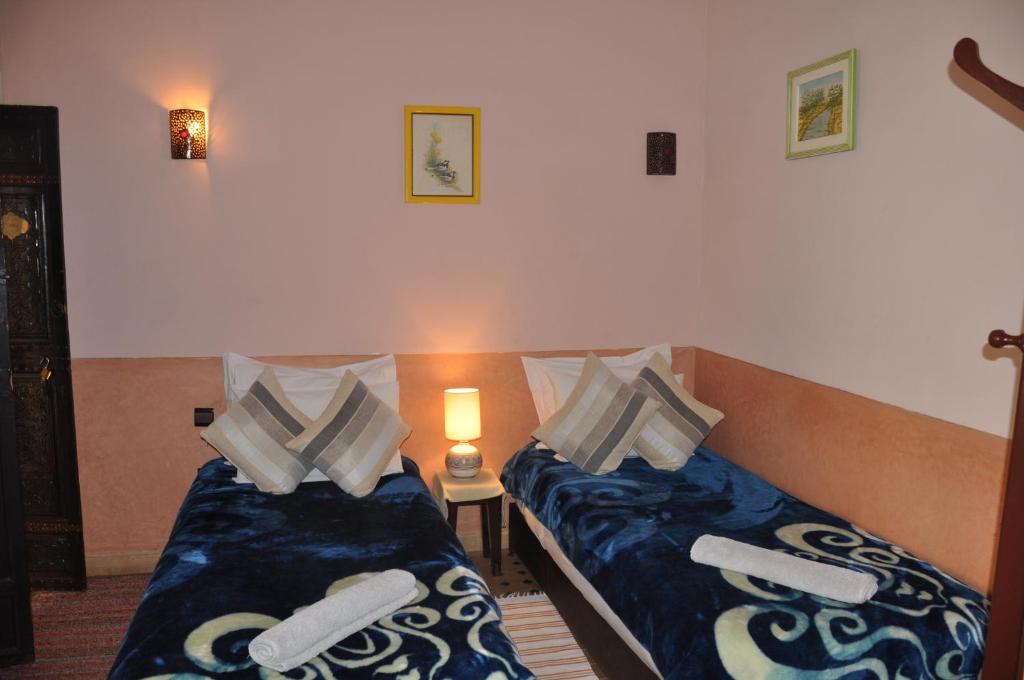 Postel nebo postele na pokoji v ubytování Riad des Etoiles