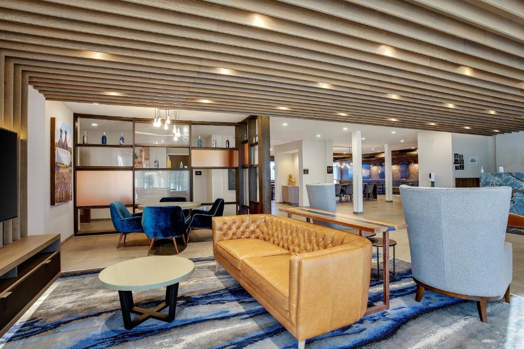 a living room with a couch and a table at Fairfield Inn & Suites Bardstown in Bardstown