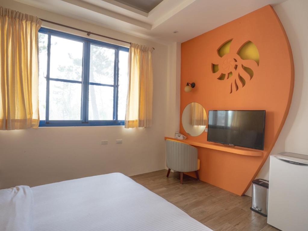 TV a/nebo společenská místnost v ubytování Easy Stay B&B