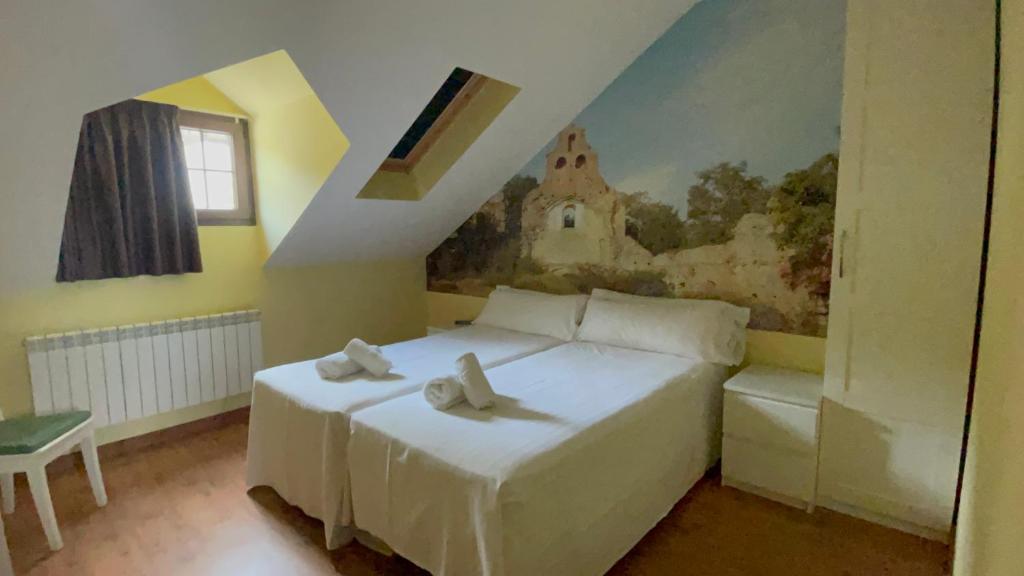 Postel nebo postele na pokoji v ubytování The Way Hotel Molinaseca
