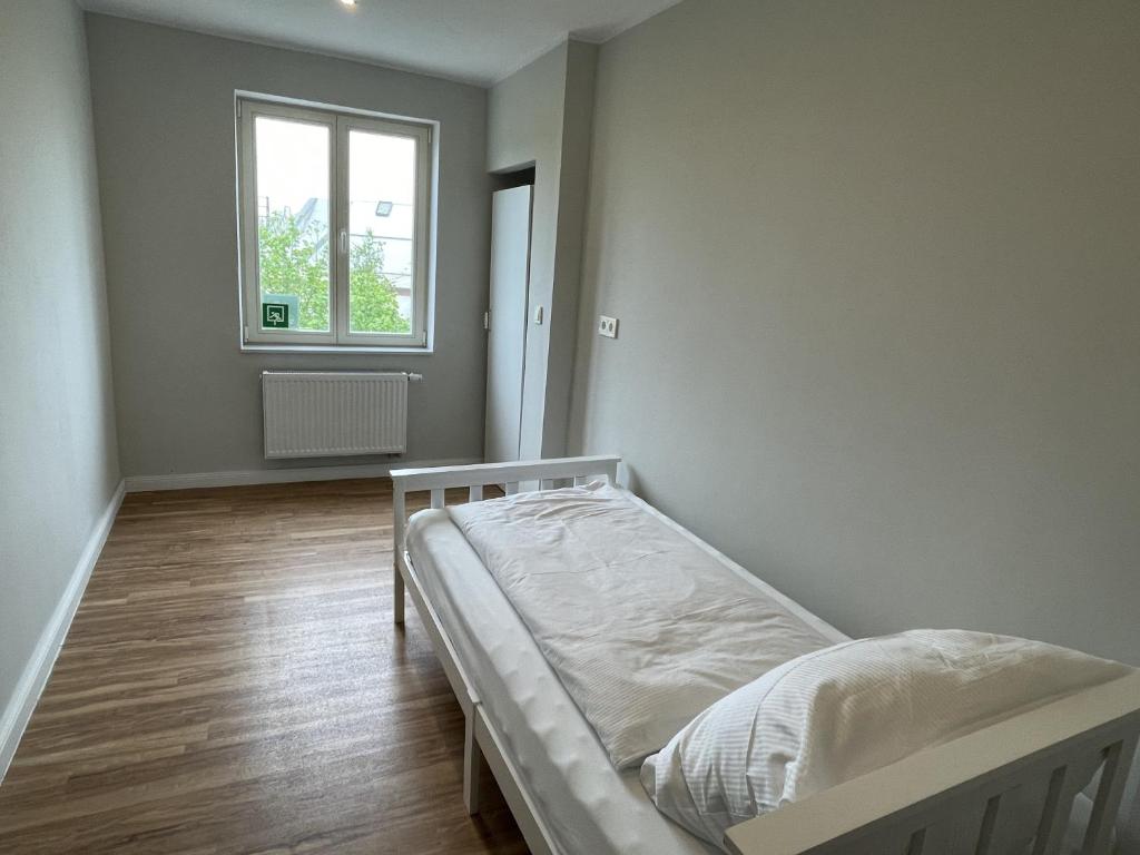 Postel nebo postele na pokoji v ubytování Ahoi Hostel