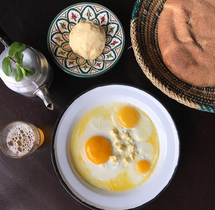 two fried eggs on a plate on a table at Beni Mellal in Oulad Hamdane