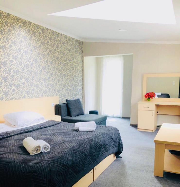 Postel nebo postele na pokoji v ubytování Guest House Vanda