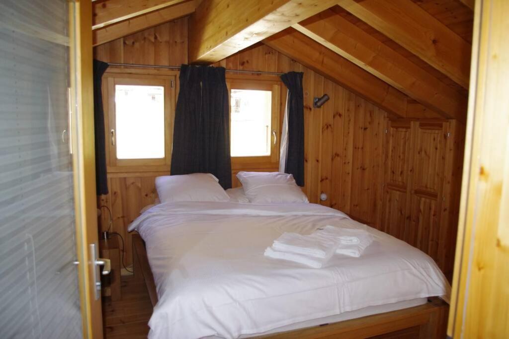 Postel nebo postele na pokoji v ubytování Chalet Mille Étoiles