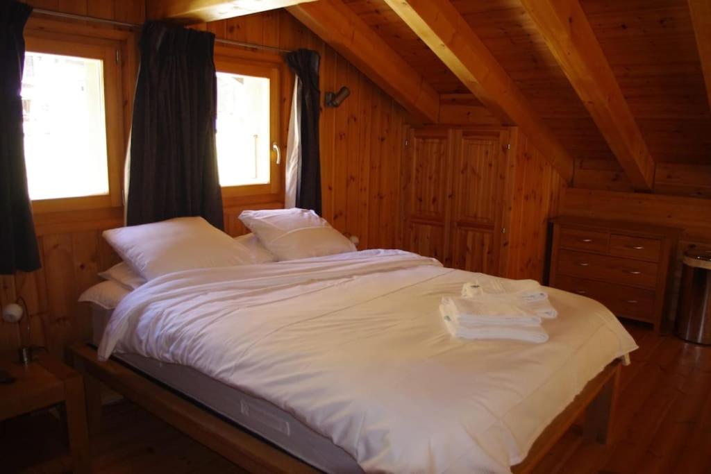 Postel nebo postele na pokoji v ubytování Chalet Mille Étoiles