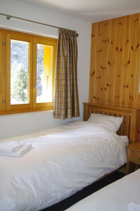 Postel nebo postele na pokoji v ubytování Chalet Mille Étoiles