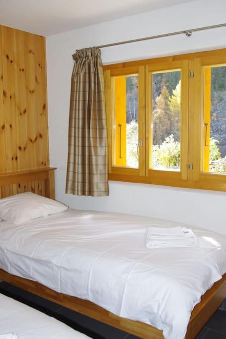 Postel nebo postele na pokoji v ubytování Chalet Mille Étoiles