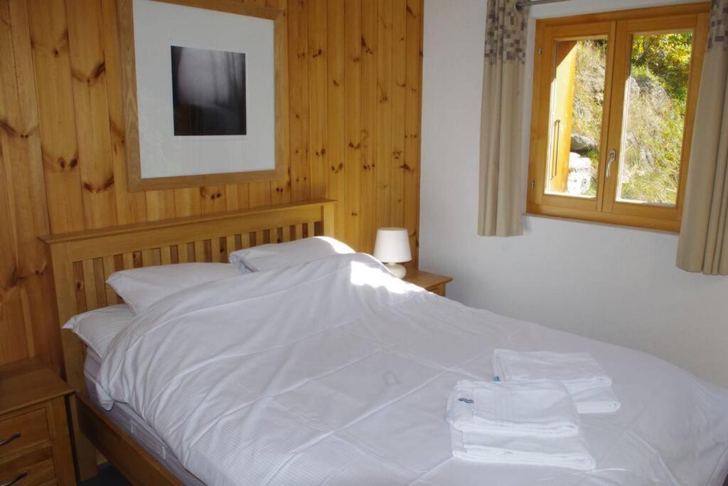 Postel nebo postele na pokoji v ubytování Chalet Mille Étoiles