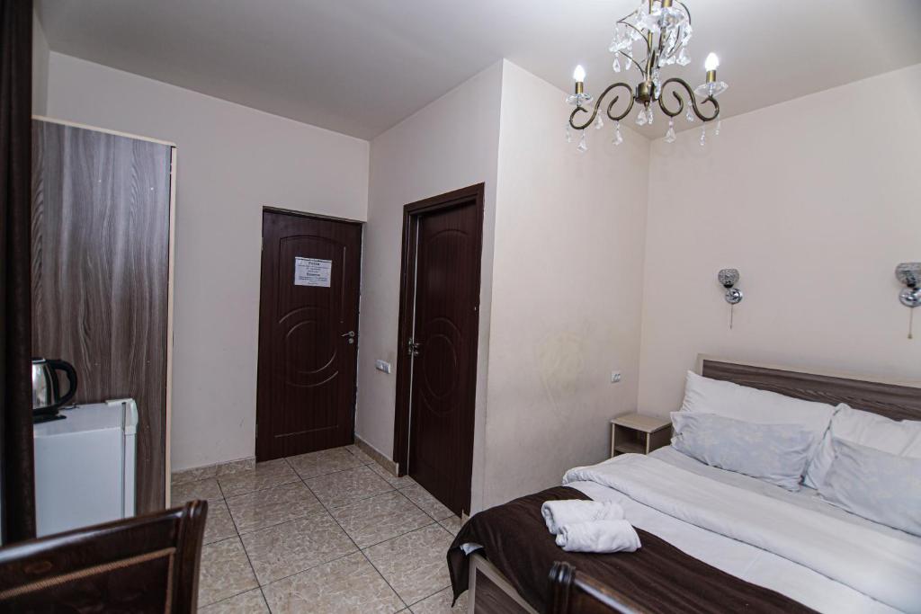 Postel nebo postele na pokoji v ubytování Comfort House Hotel