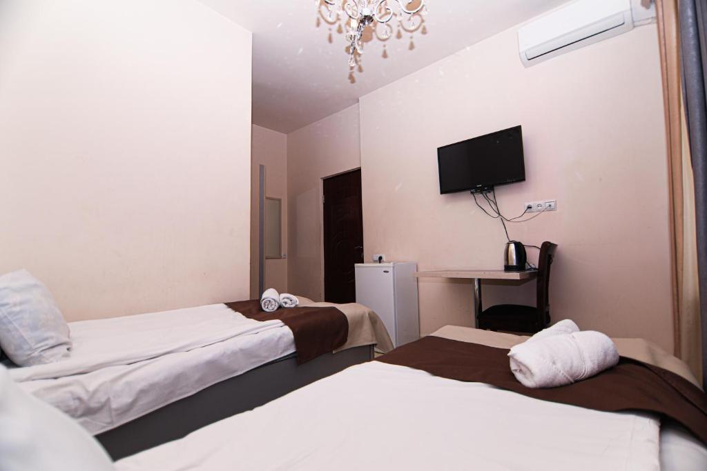 Postel nebo postele na pokoji v ubytování Comfort House Hotel