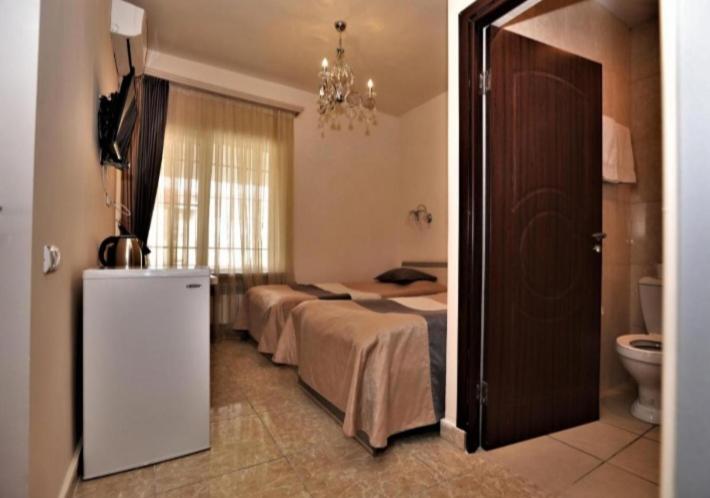 Postel nebo postele na pokoji v ubytování Comfort House Hotel