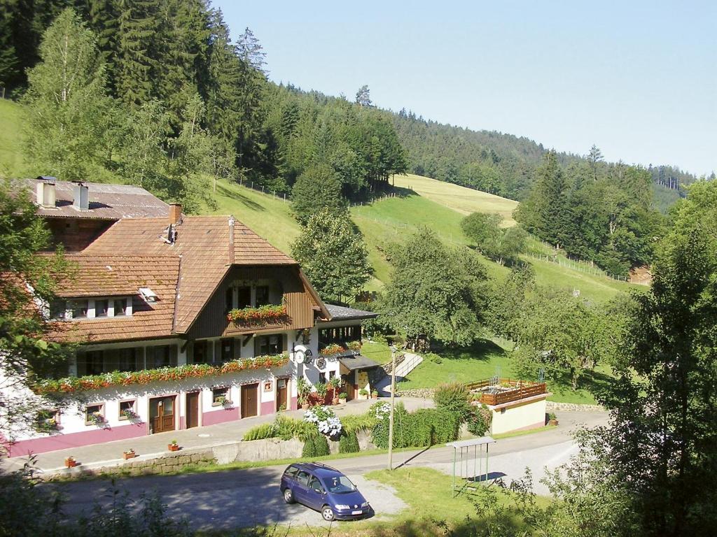 a house with a car parked in front of it at Zuwälder Stüble in Oberharmersbach