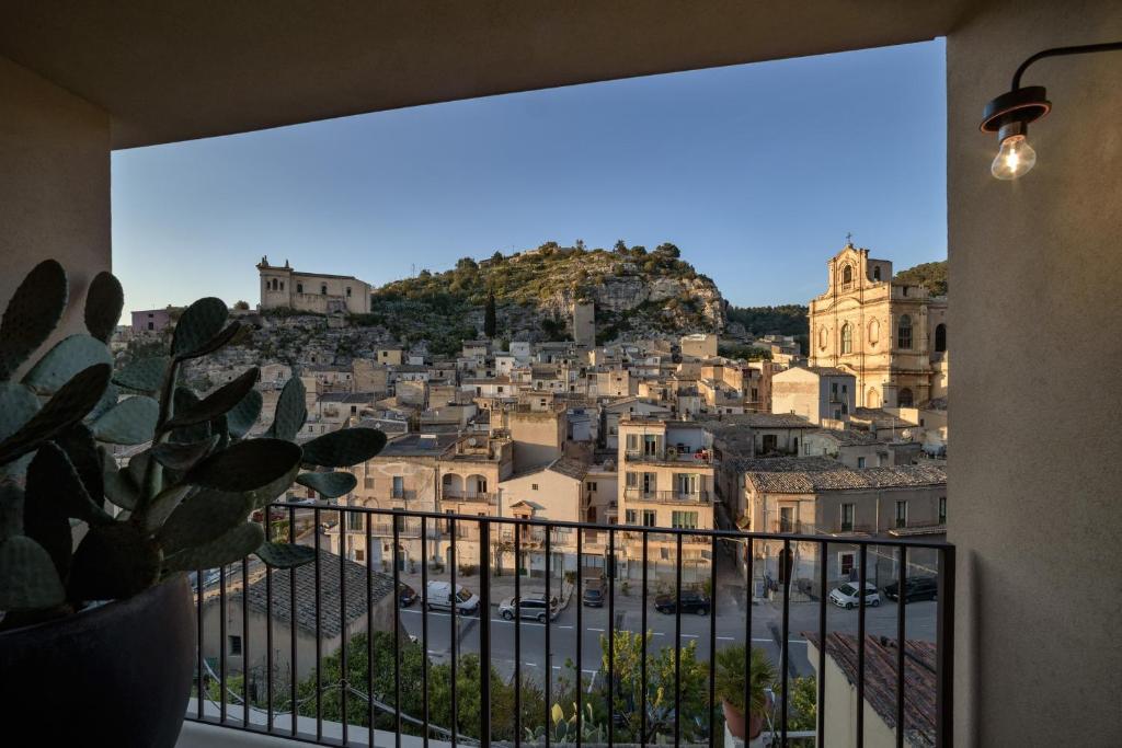 a view of a city from a balcony at Appartamenti con vista - Pomelia in Scicli