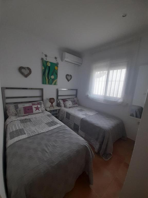 Postel nebo postele na pokoji v ubytování Villa Lolera