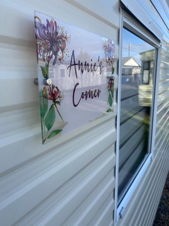 a window on a house with a sign that reads animals corner at Annie’s Corner in Ingoldmells