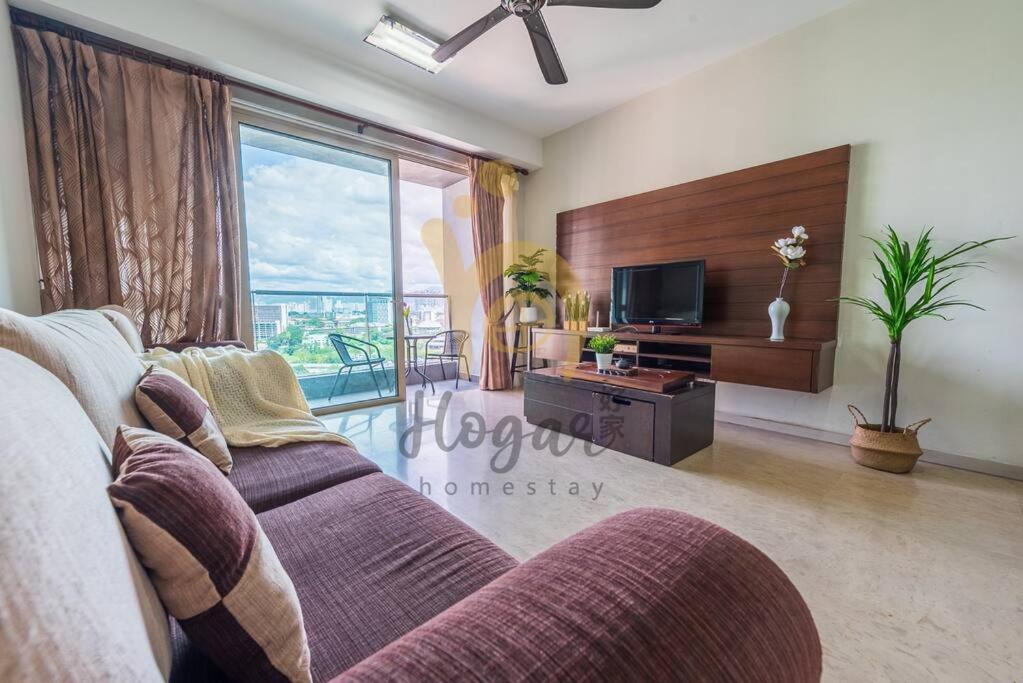 a living room with a couch and a tv at Myhabitat KLCC 2bedroom Family suite w balcony #bathtub in Kuala Lumpur