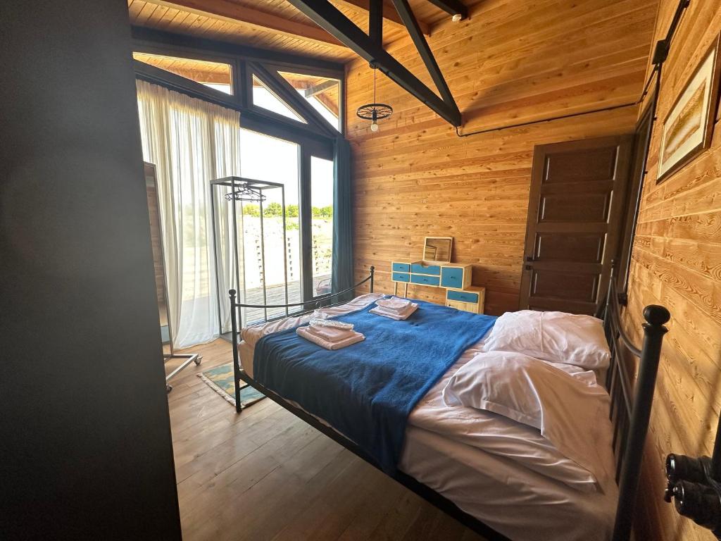 Postel nebo postele na pokoji v ubytování Eco Saguramo Chalet