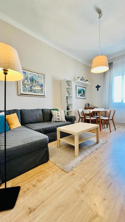 a living room with a couch and a table at Apartment Marta in Preko
