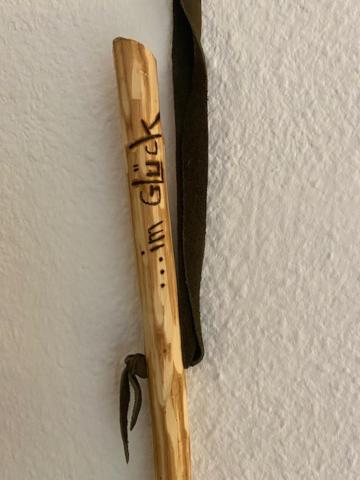 a wooden baseball bat hanging on a wall at Apartment Skischanze in Garmisch-Partenkirchen