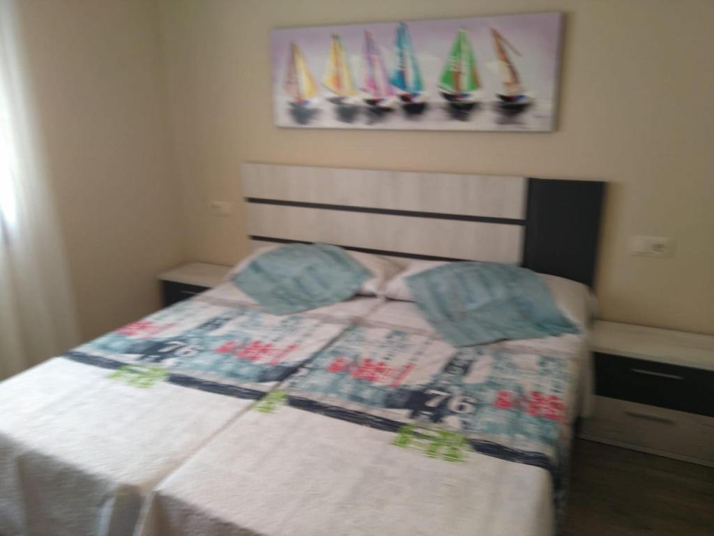 Posteľ alebo postele v izbe v ubytovaní Apartamentos A Bota