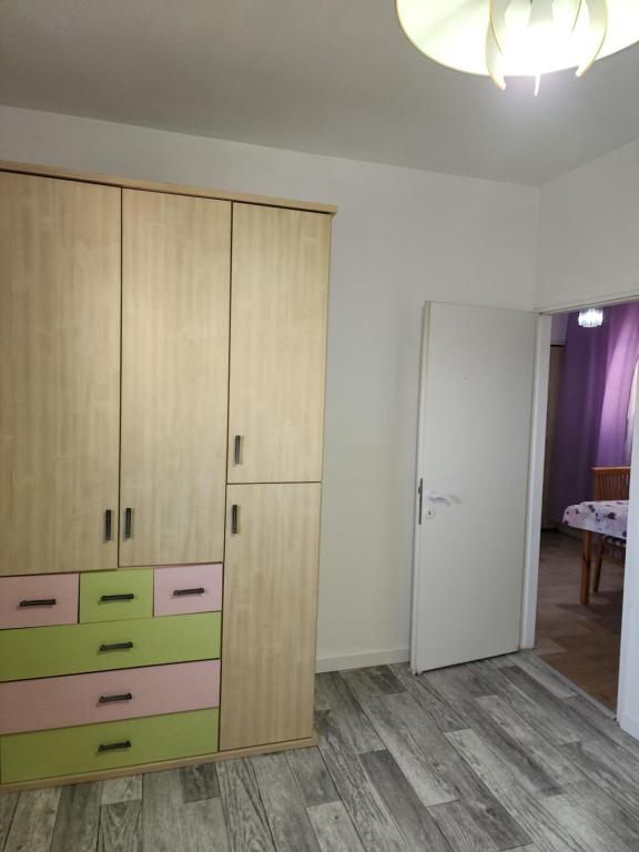 a room with wooden cabinets and a room with a table at Бат-ям 2-ком. Квартира аренда!!! in Bat Yam