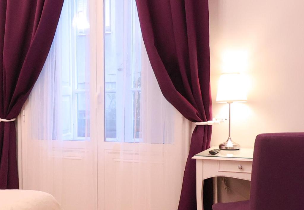 Postel nebo postele na pokoji v ubytování Opera Relais