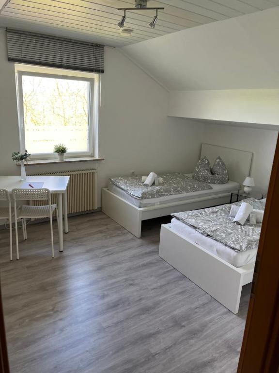 Postel nebo postele na pokoji v ubytování Pension Platzhirsch