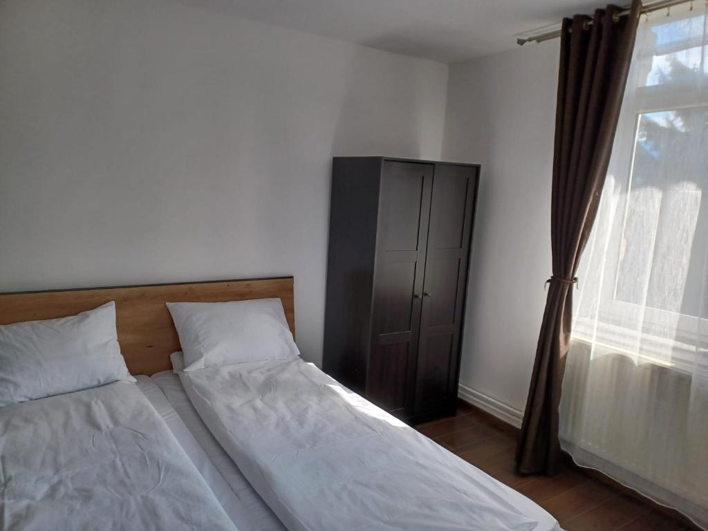 Postel nebo postele na pokoji v ubytování Vila Oltețul