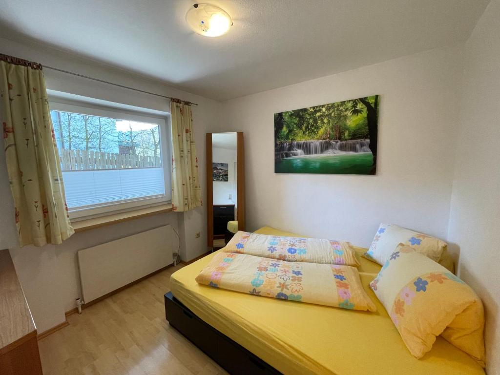 Postel nebo postele na pokoji v ubytování Ferienwohnung Maxi