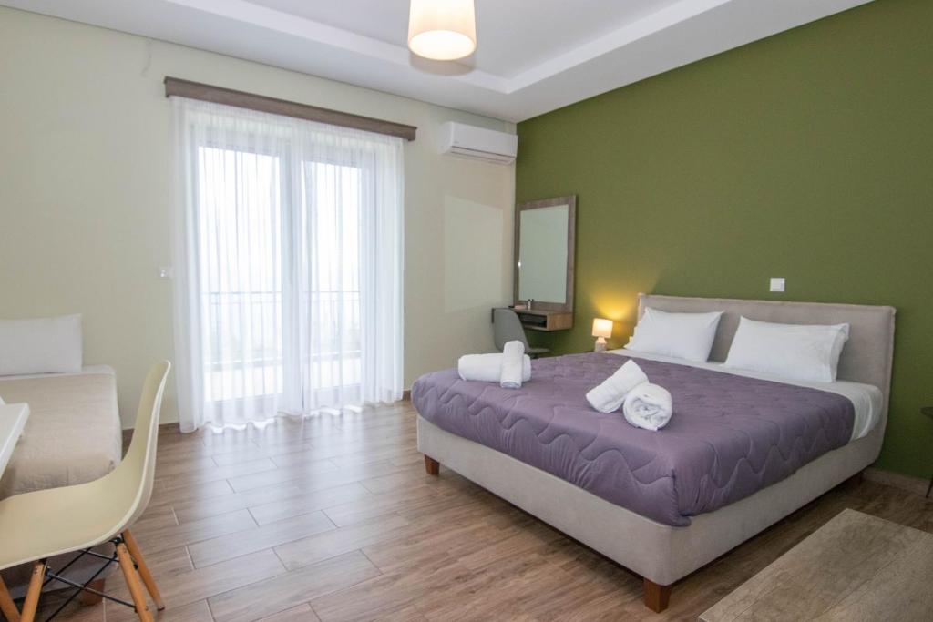 Posteľ alebo postele v izbe v ubytovaní Verga's Apartments