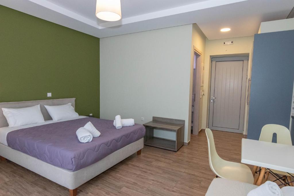 Posteľ alebo postele v izbe v ubytovaní Verga's Apartments