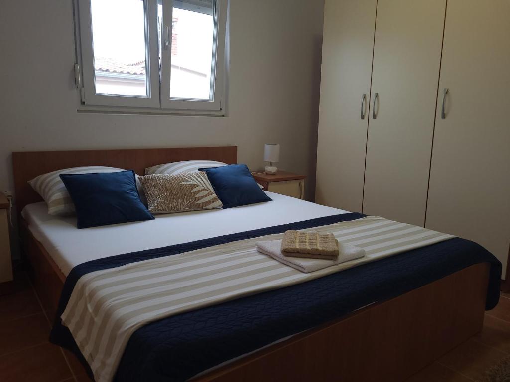 Posteľ alebo postele v izbe v ubytovaní Apartments Bralic