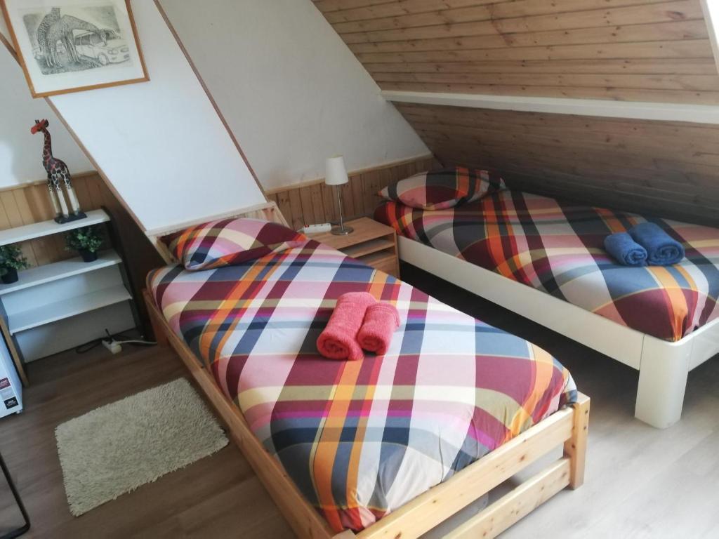 Postel nebo postele na pokoji v ubytování Residentie Blijdorp