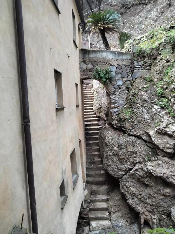 a stairway leading up to a stone building at Casa dell'Arco Civico 35 in San Fruttuoso